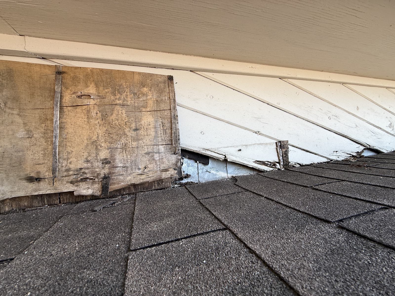 Fascia board rotted through behind the gutter