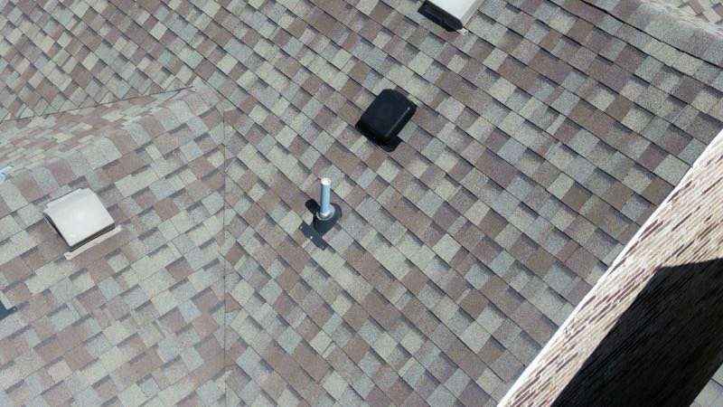 Overhead view of roof vents and a satellite mount
